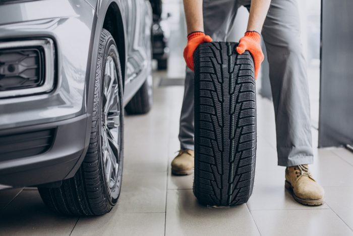 mechanic changing tires car service
