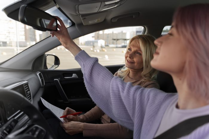 woman taking her driver s license test vehicle