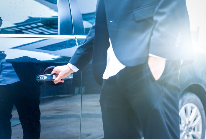 business man opens door