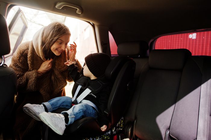 young mother child car baby seat chair safety driving concept 1